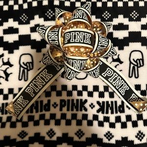 4 Victoria secret pink display bows.  See photos 2 and 3 for crease/bend mark.